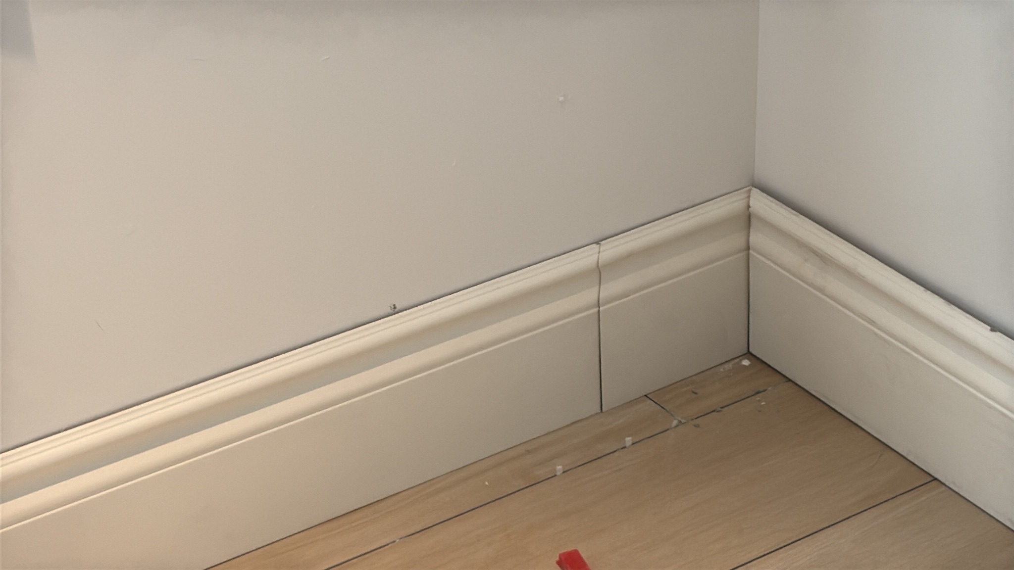 Finished baseboard room corner